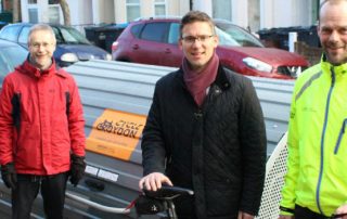 Councillor Stuart King (centre) and Croydon Council staff with one of the new hangars.