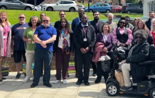 A group photo of residents and staff