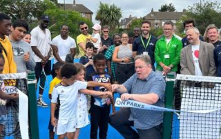 Jason Perry at ribbon cutting of parks reopening with some residents