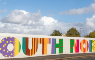 Photo of a mural on Goathouse Bridge with the words South Norwood