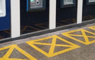 An ATM machine with security markings.