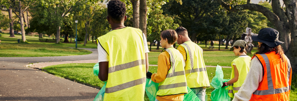 young people doing voluntary work litter picking