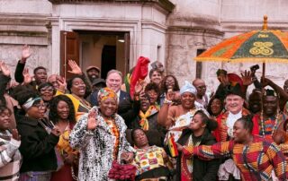 Crowds gather outside the Town Hall with the Mayor and Civic Mayor to mark Ghanaian Independence Day.