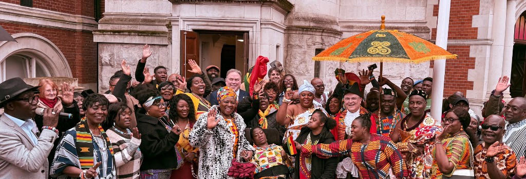 Crowds gather outside the Town Hall with the Mayor and Civic Mayor to mark Ghanaian Independence Day.