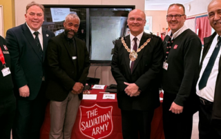 Mayor Perry and the Civic Mayor with members of the Salvation Army.
