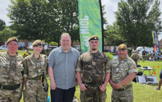 Mayor Perry at the New Addington Carnival with members of the armed forces.