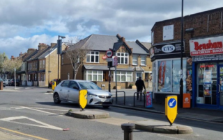 A row of shops in Bensham with a car in front.