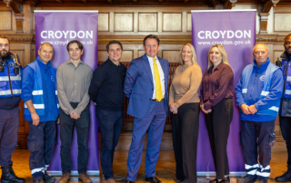 Members of Croydon BID stand together in Braithwaite Hall.